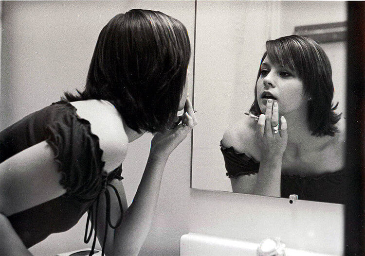 woman makeup in a mirror